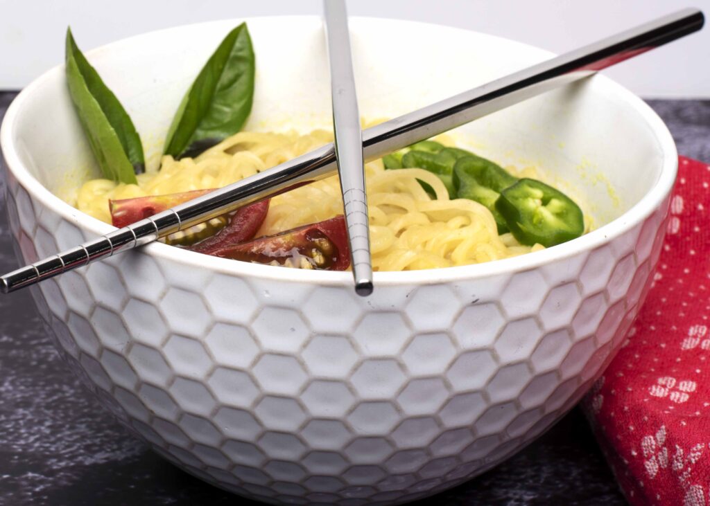 Stainless Steel Chopsticks on Bowl of Noodles